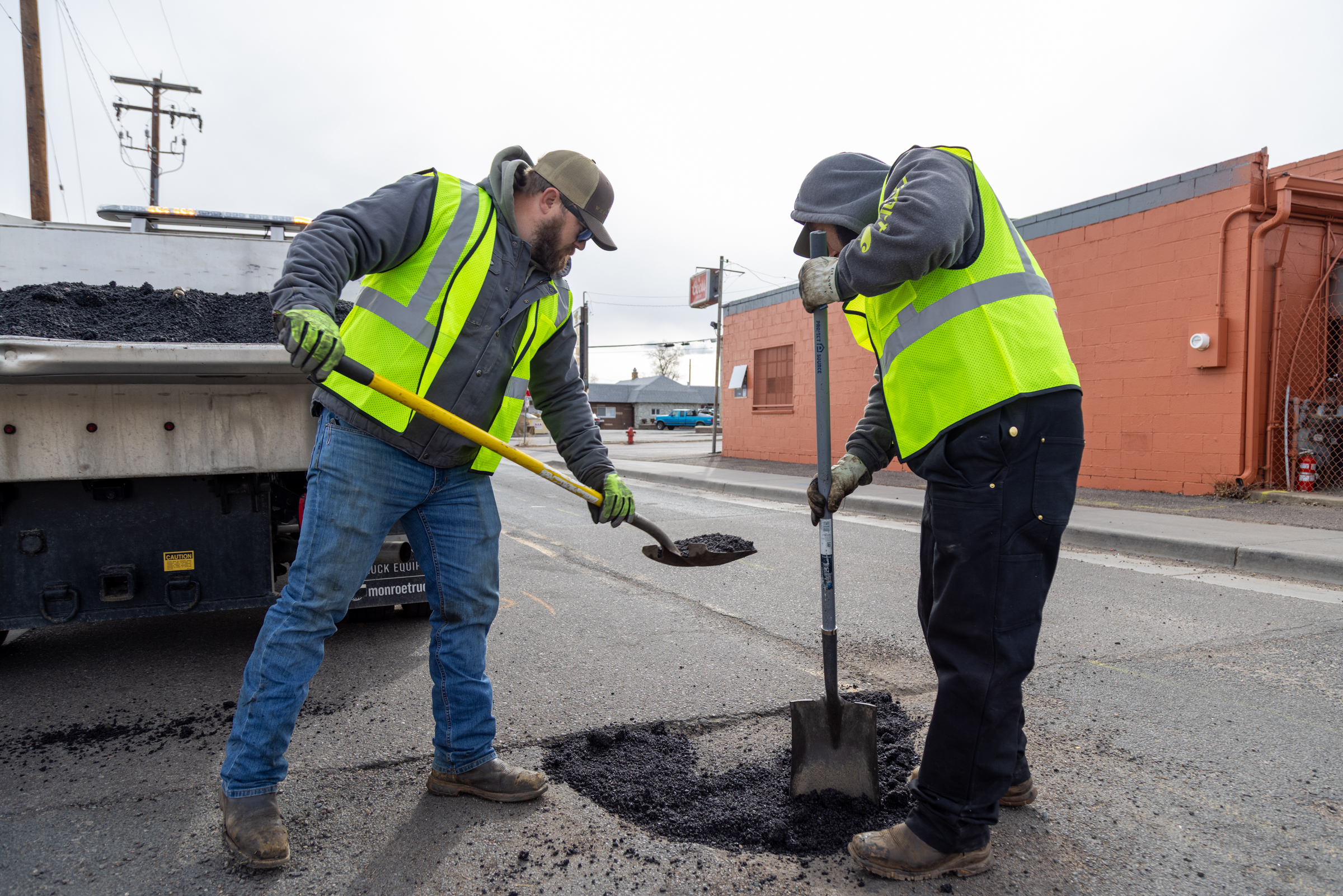 Street crews fixing a pothole